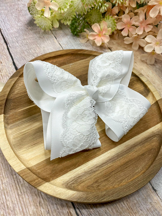 White Chantilly Lace Classic Hair Bow on wood