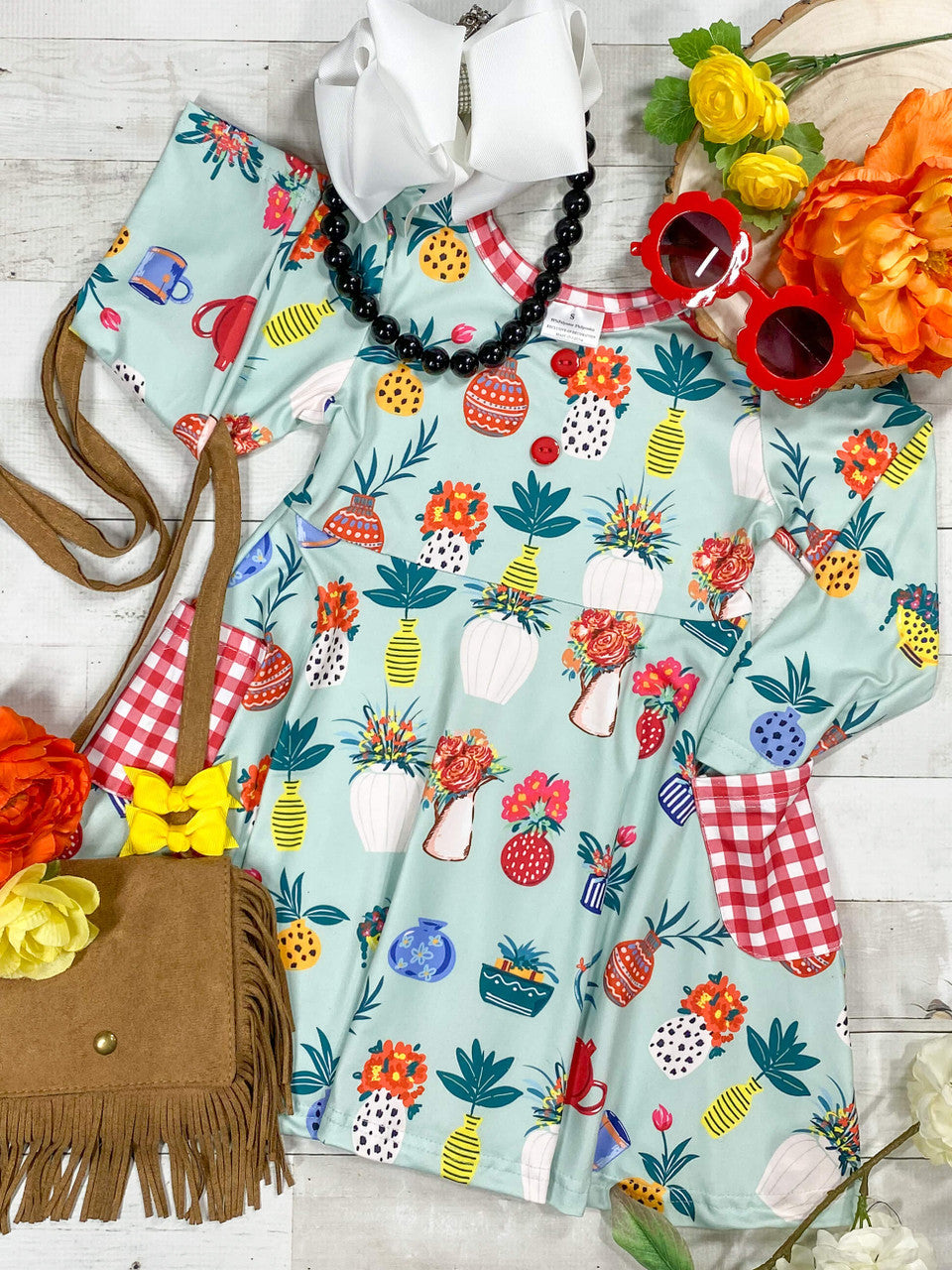 Light Blue Dress With Potted Plants Pattern & Gingham Pocket Design.