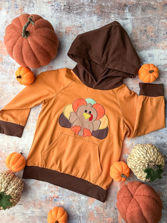 orange long sleeve with turkey and brown hoodie