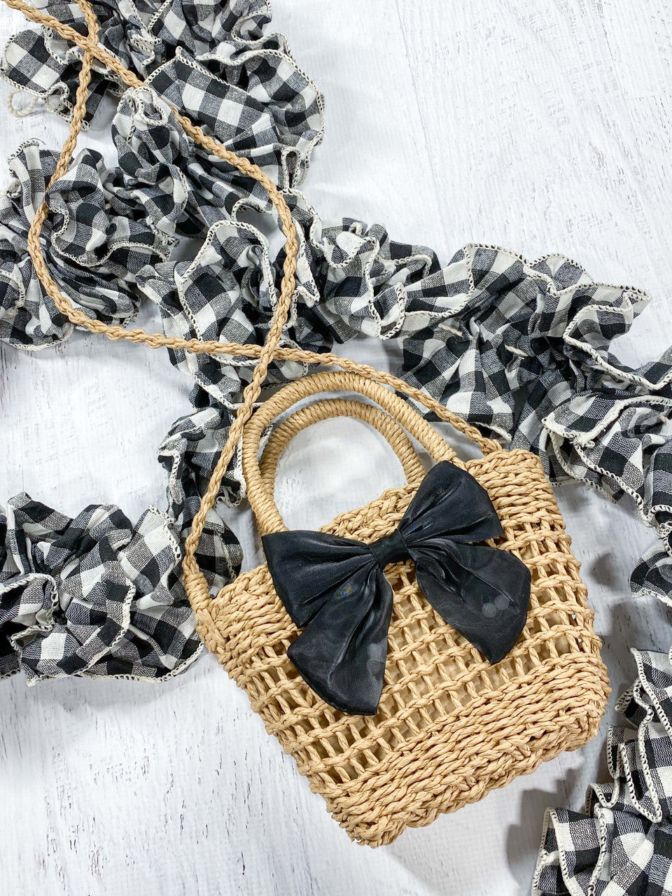 Purse shown with shoulder carrying strap