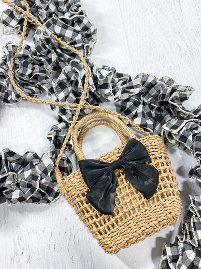 Purse shown with shoulder carrying strap