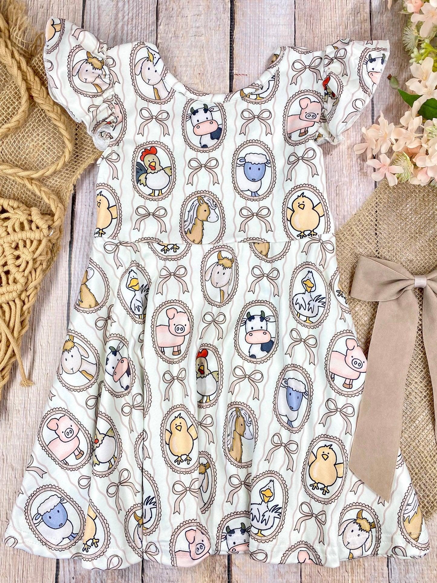Boutique Girls Farm Animal Dress on a wooden background