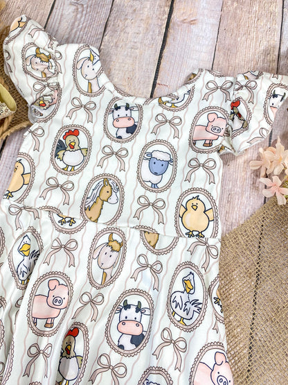 Boutique Girls Farm Animal Dress on a wooden background