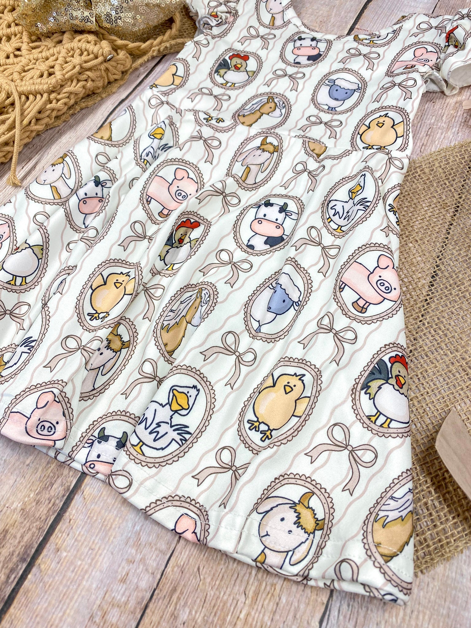 Boutique Girls Farm Animal Dress on a wooden background