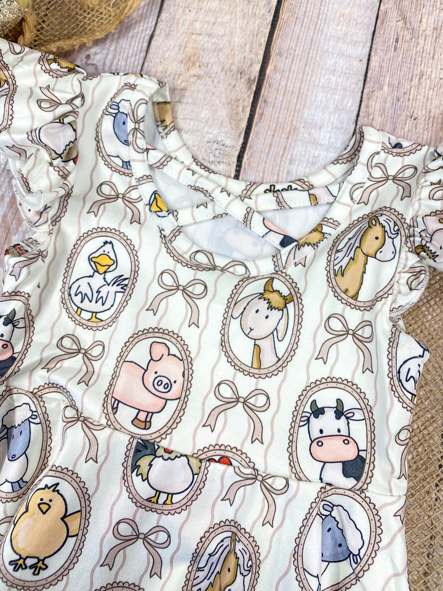 Boutique Girls Farm Animal Dress on a wooden background