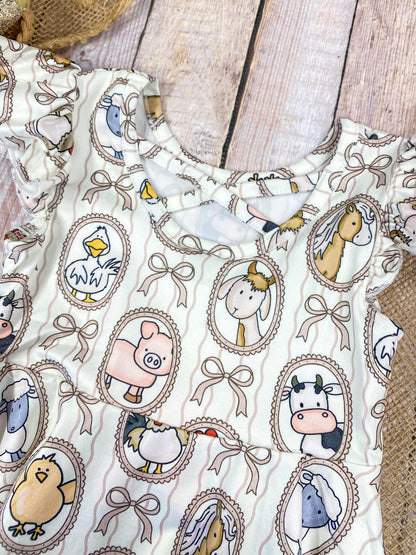 Boutique Girls Farm Animal Dress on a wooden background