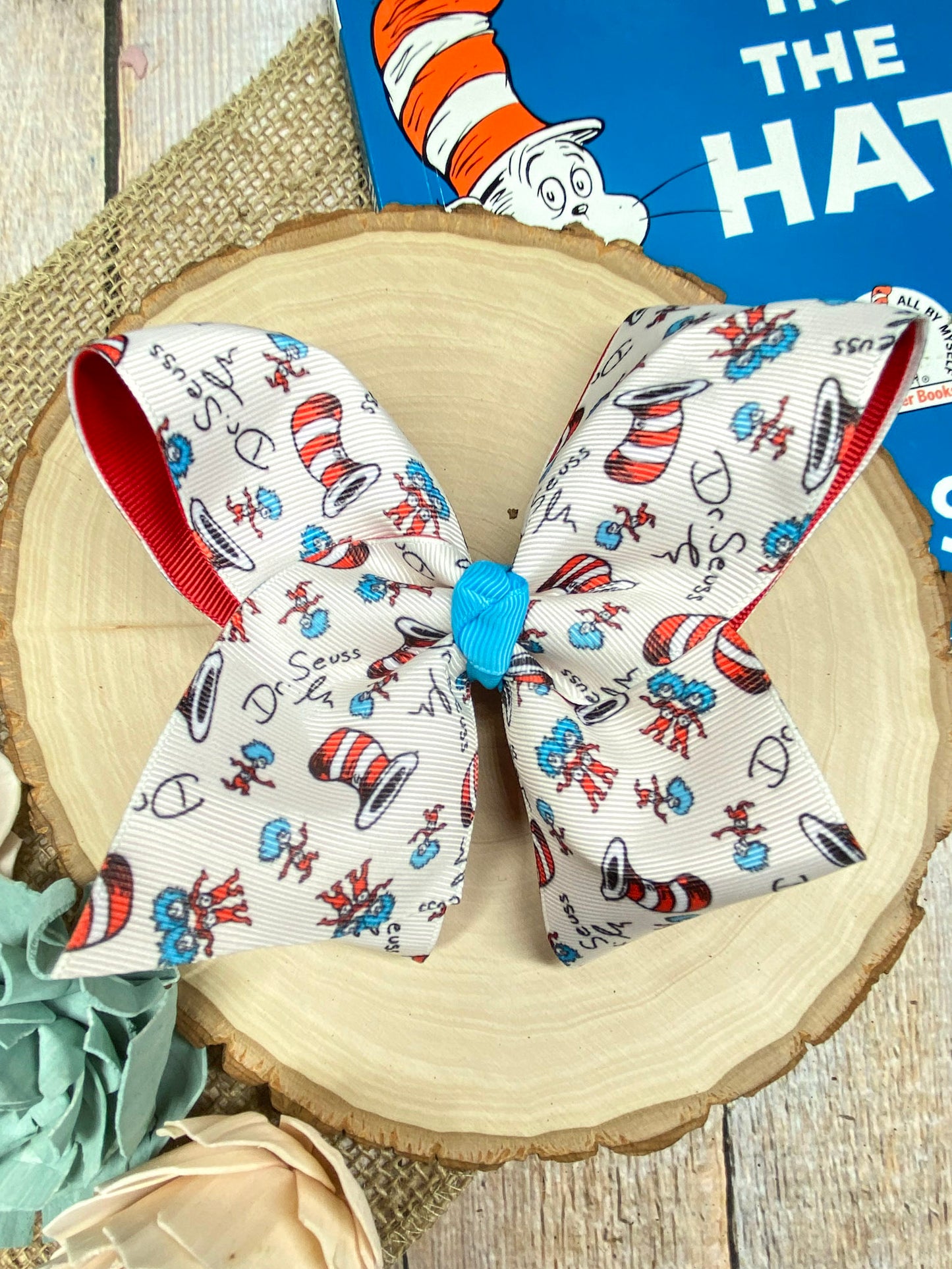 Suess Print Double Layer Hair Bow on a wooden background
