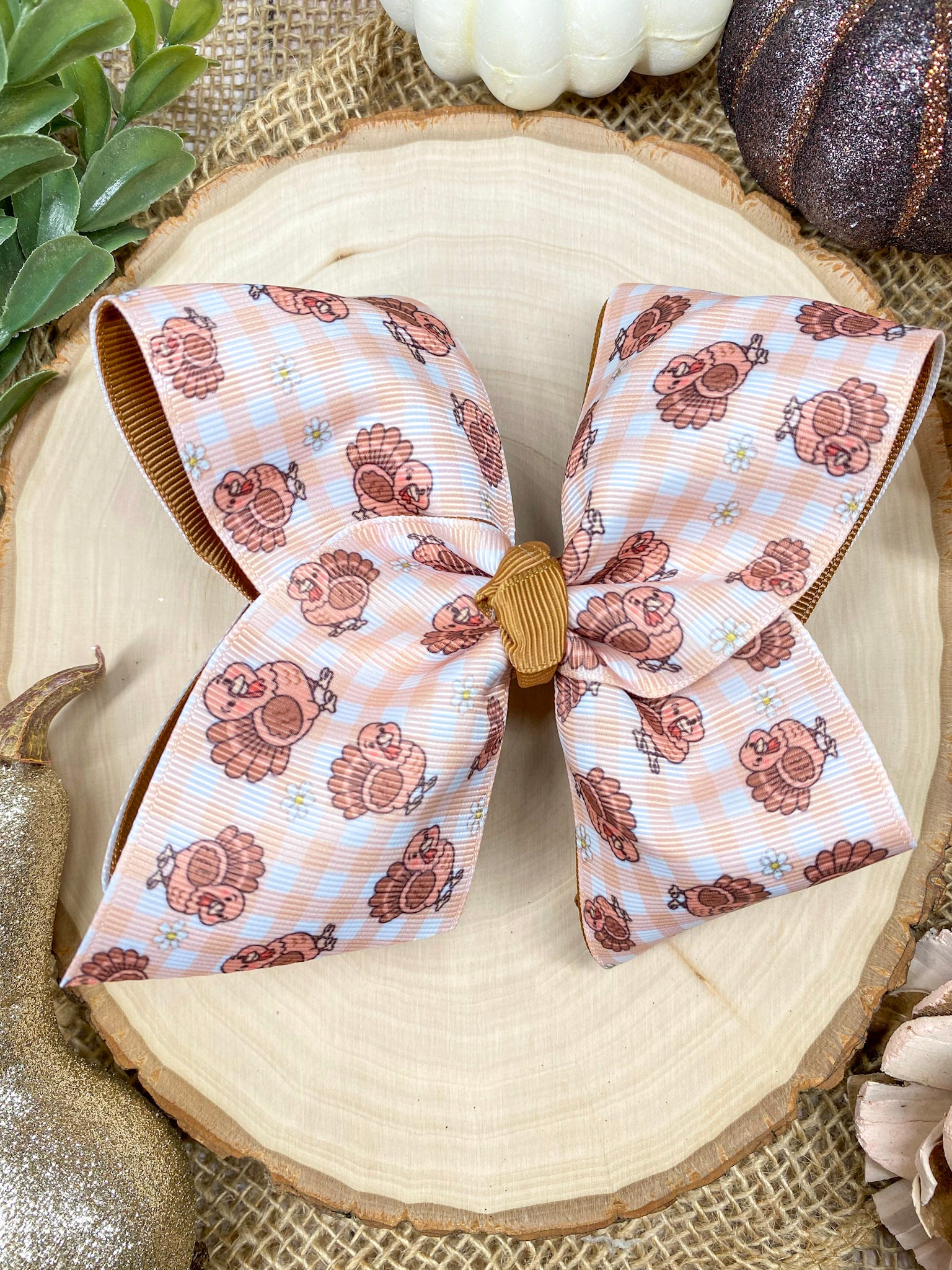 Turkey Print Hair Bow on a wooden background
