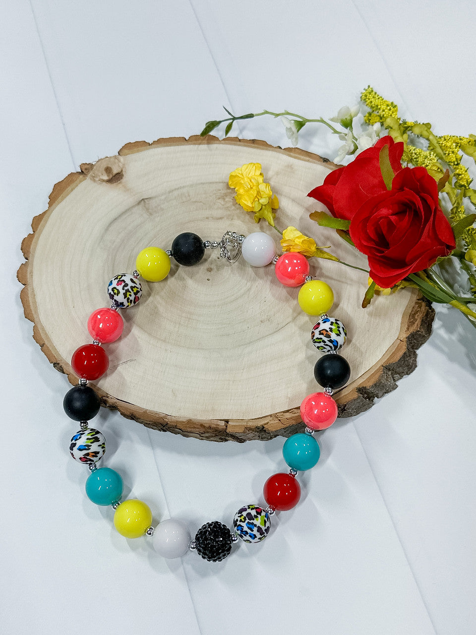 Colorful cheetah bubblegum necklace; measures approx 17"; toggle closure.