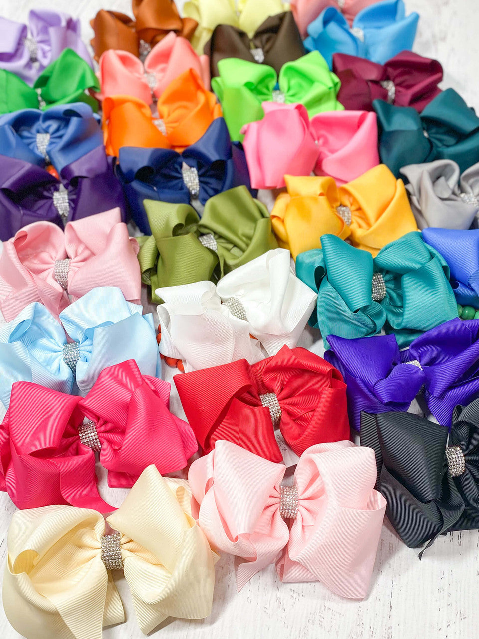 Texas Size rhinestone center hair bows in several colors