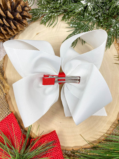 Wreath Embroidered Hair Bow on a wooden background