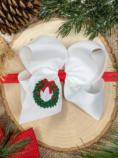 Wreath Embroidered Hair Headband on a wooden background