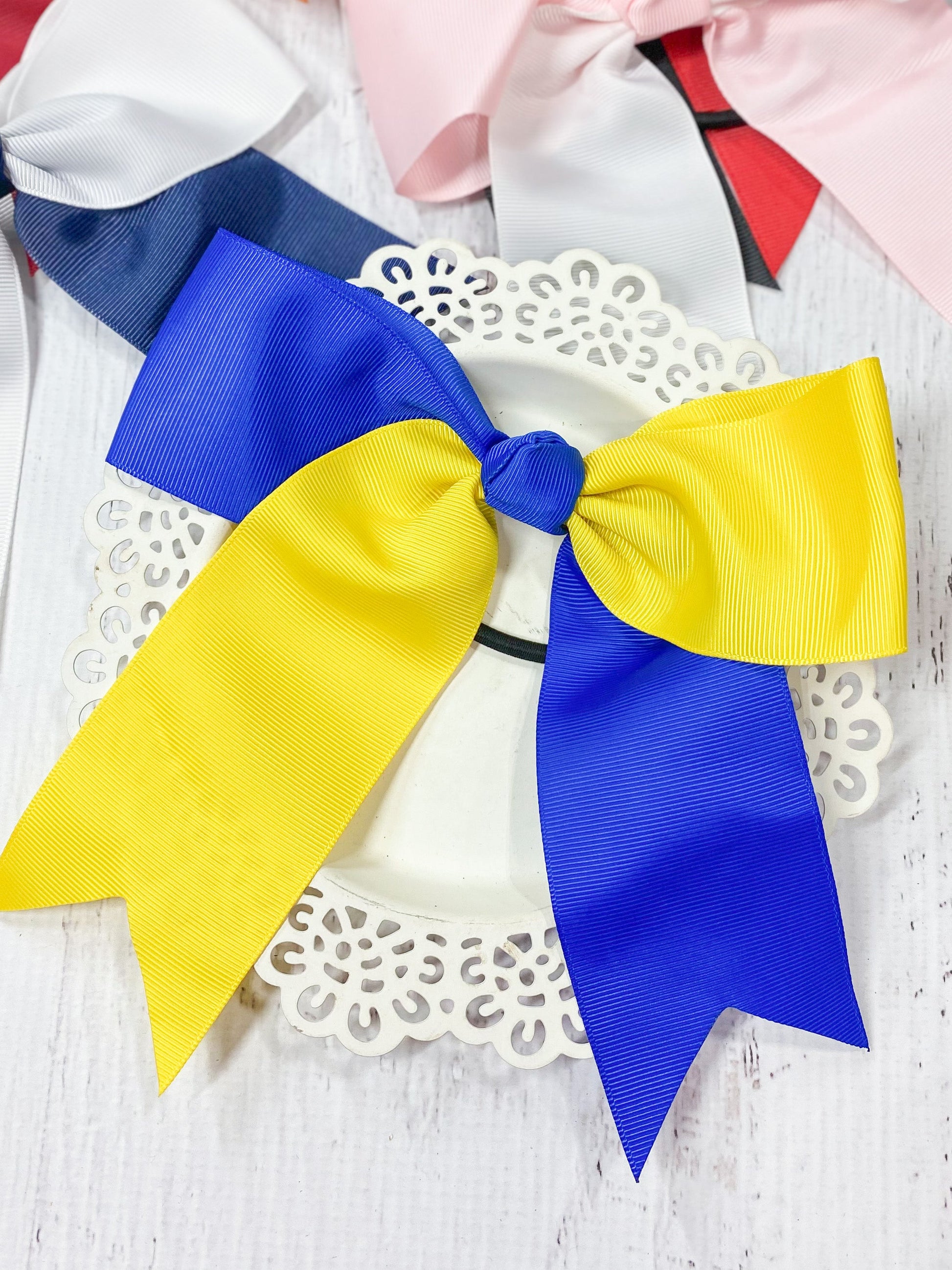 blue and yellow school spirit cheer bow