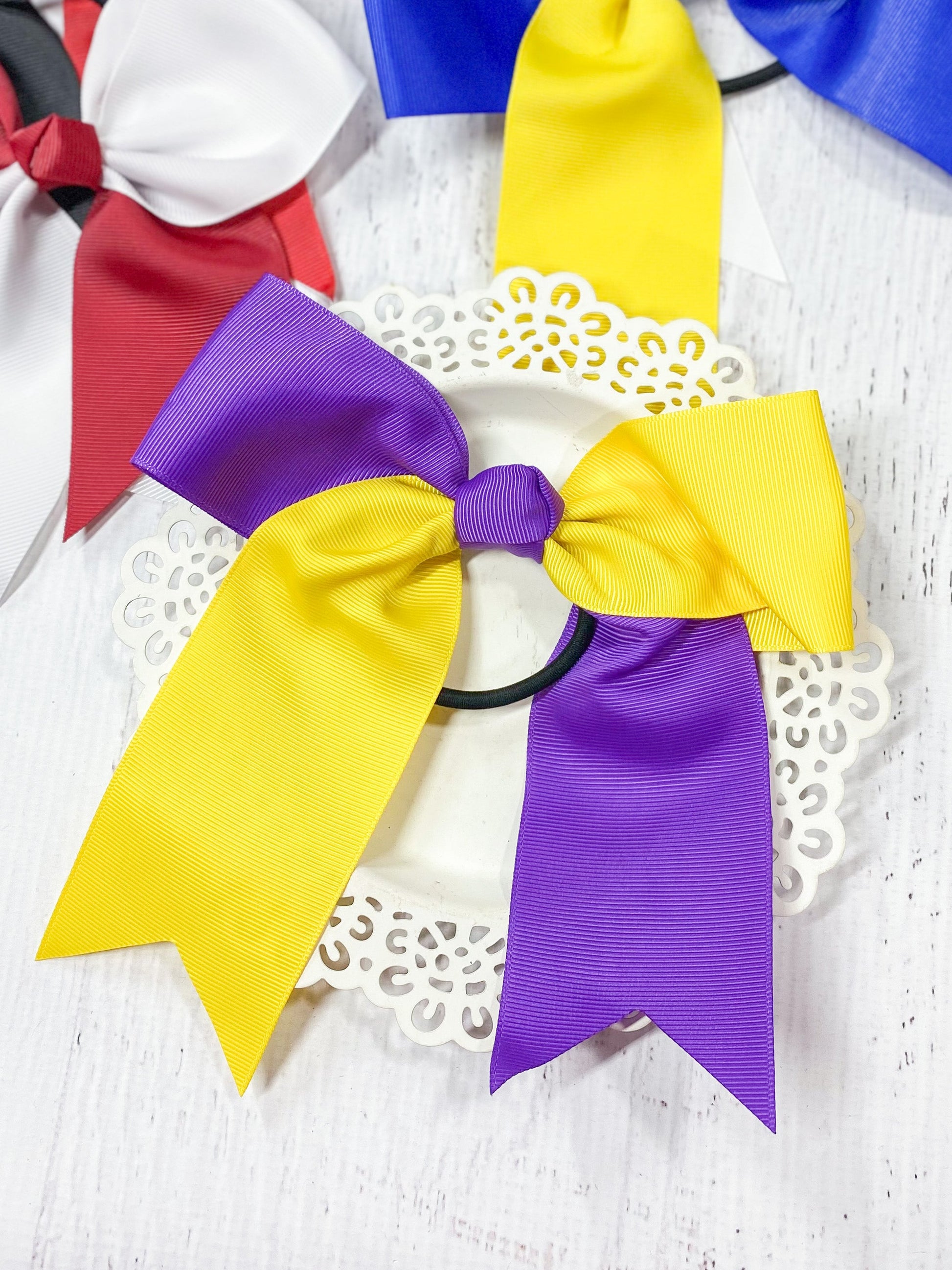purple and yellow school spirit cheer bow