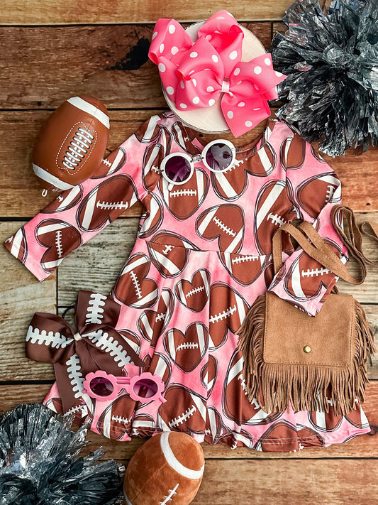 pink twirl dress with football hearts 