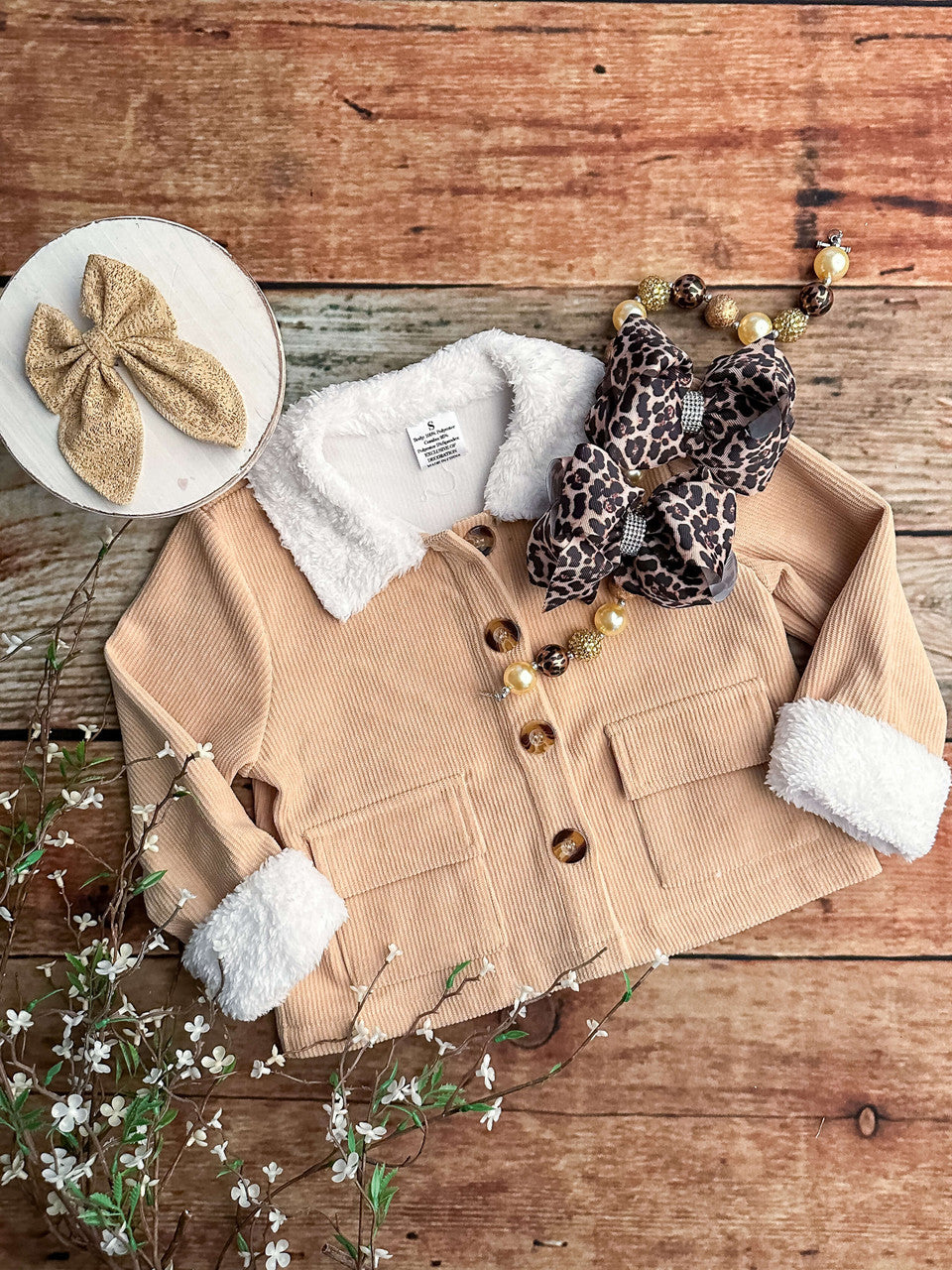 Tan jacket. Accessories not included. 