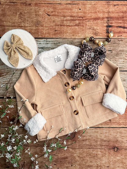 Tan jacket. Accessories not included. 