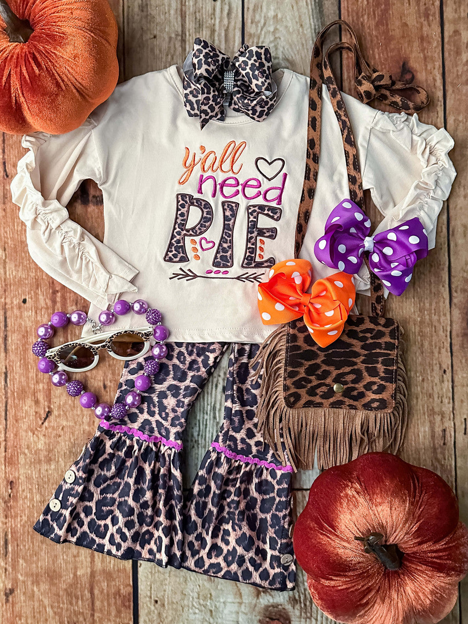 Y'all need pie embroidered long sleeve top and animal print bell bottoms