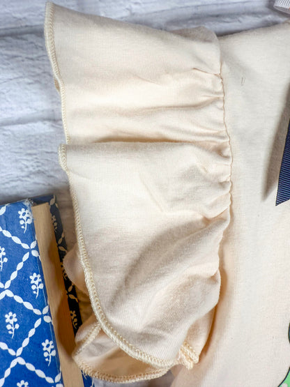 close up photo of ruffled sleeves