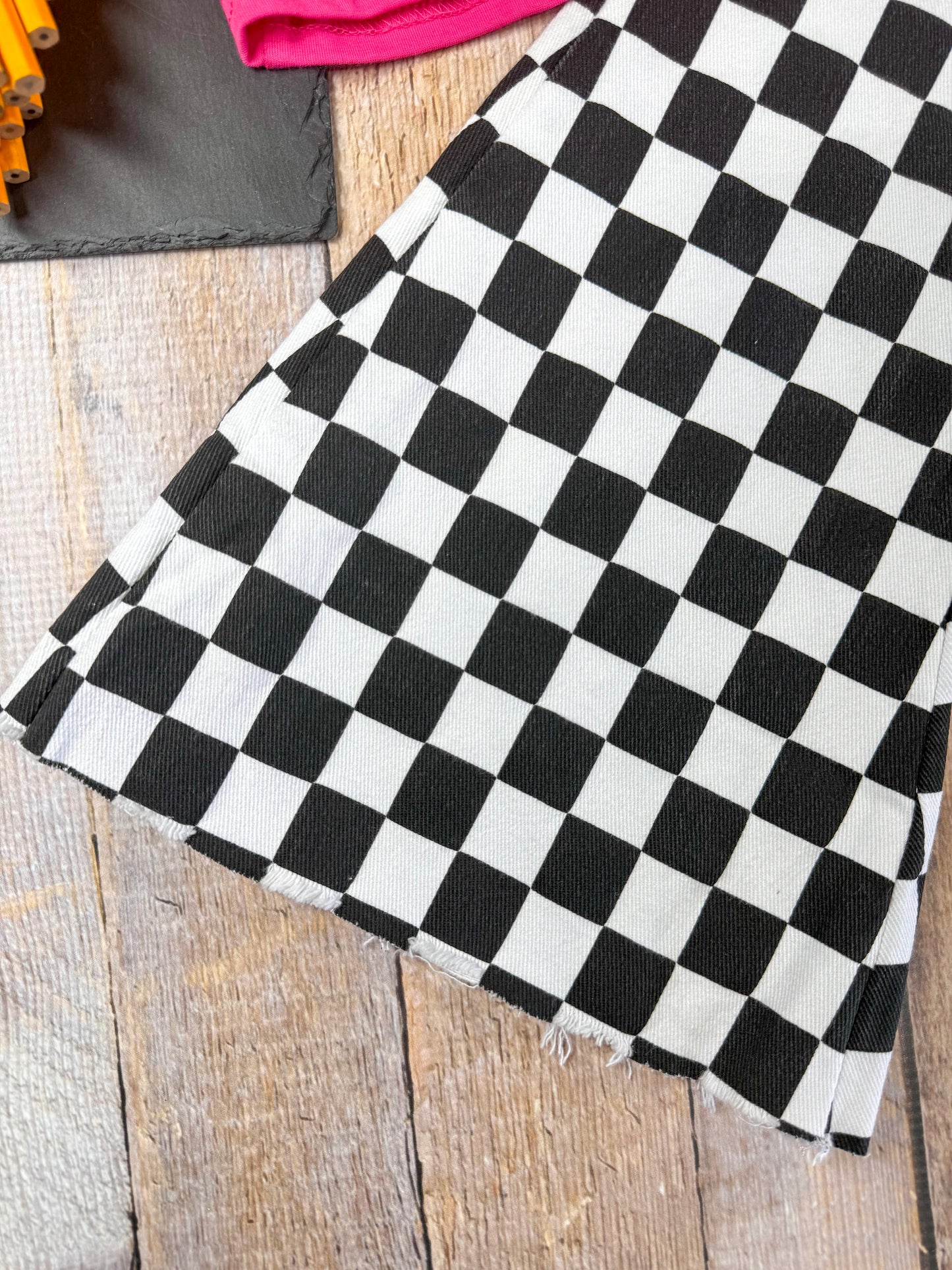 close up photo of the end of the flared & checkered pants
