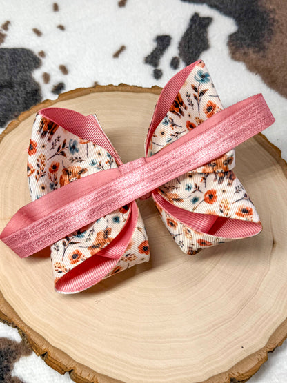 back of the bow headband showing the satin elastic band