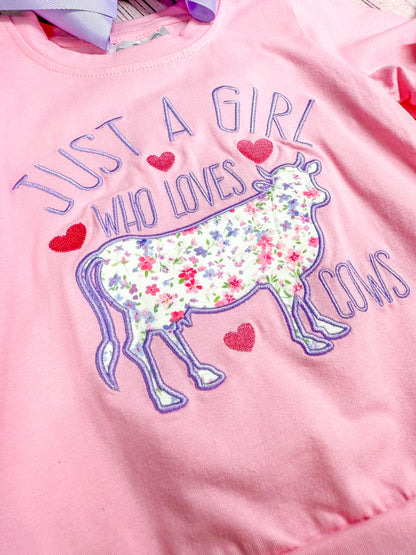 close up of "just a girl who loves cows" with cow embroidery