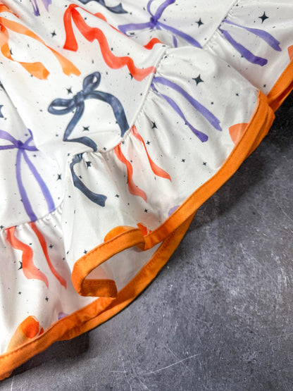 close up of orange trim on dress