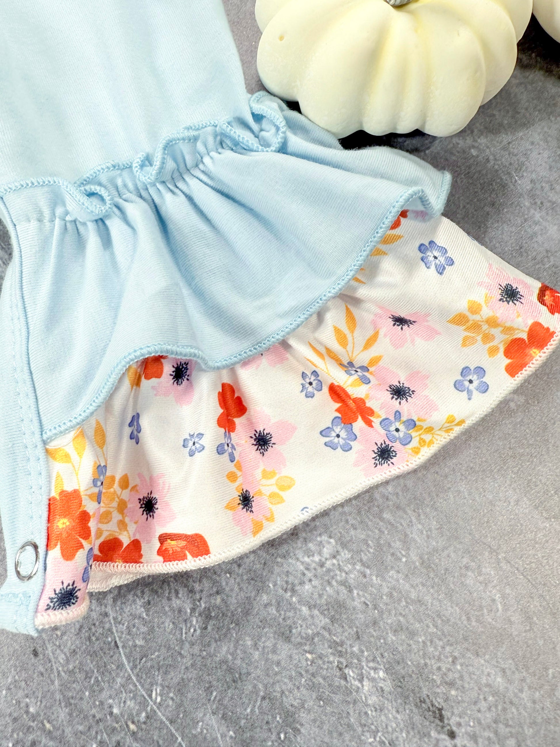 close up of floral ruffle pant leg