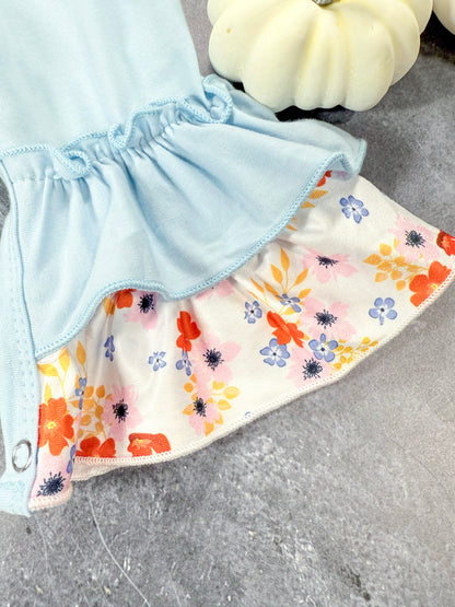 close up of floral ruffle pant leg