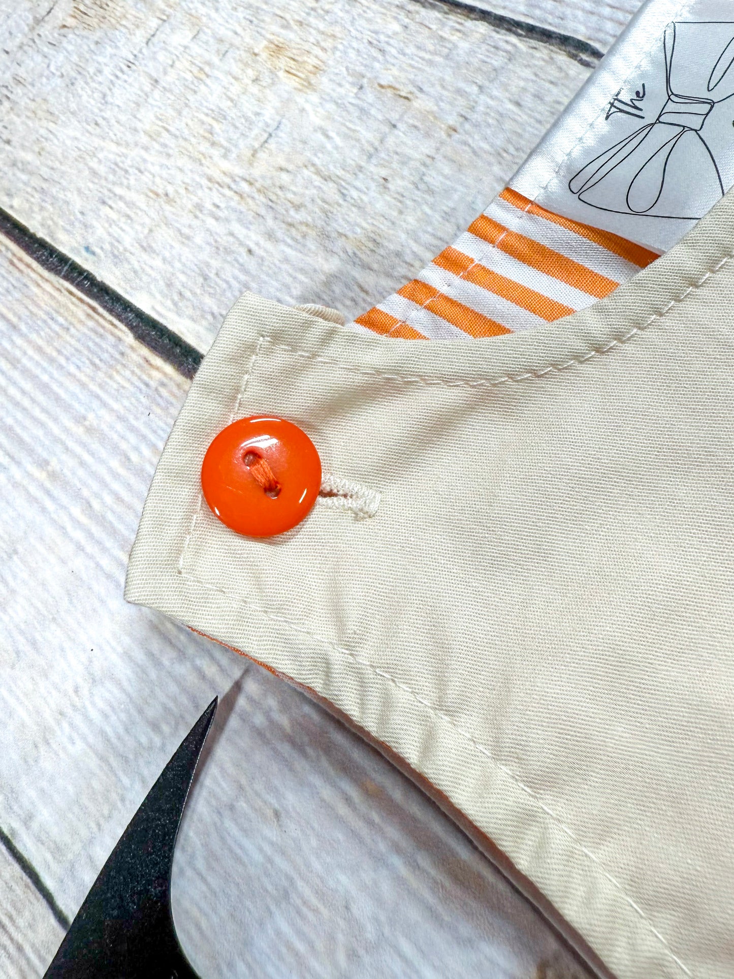 close up of the button at top of shoulder