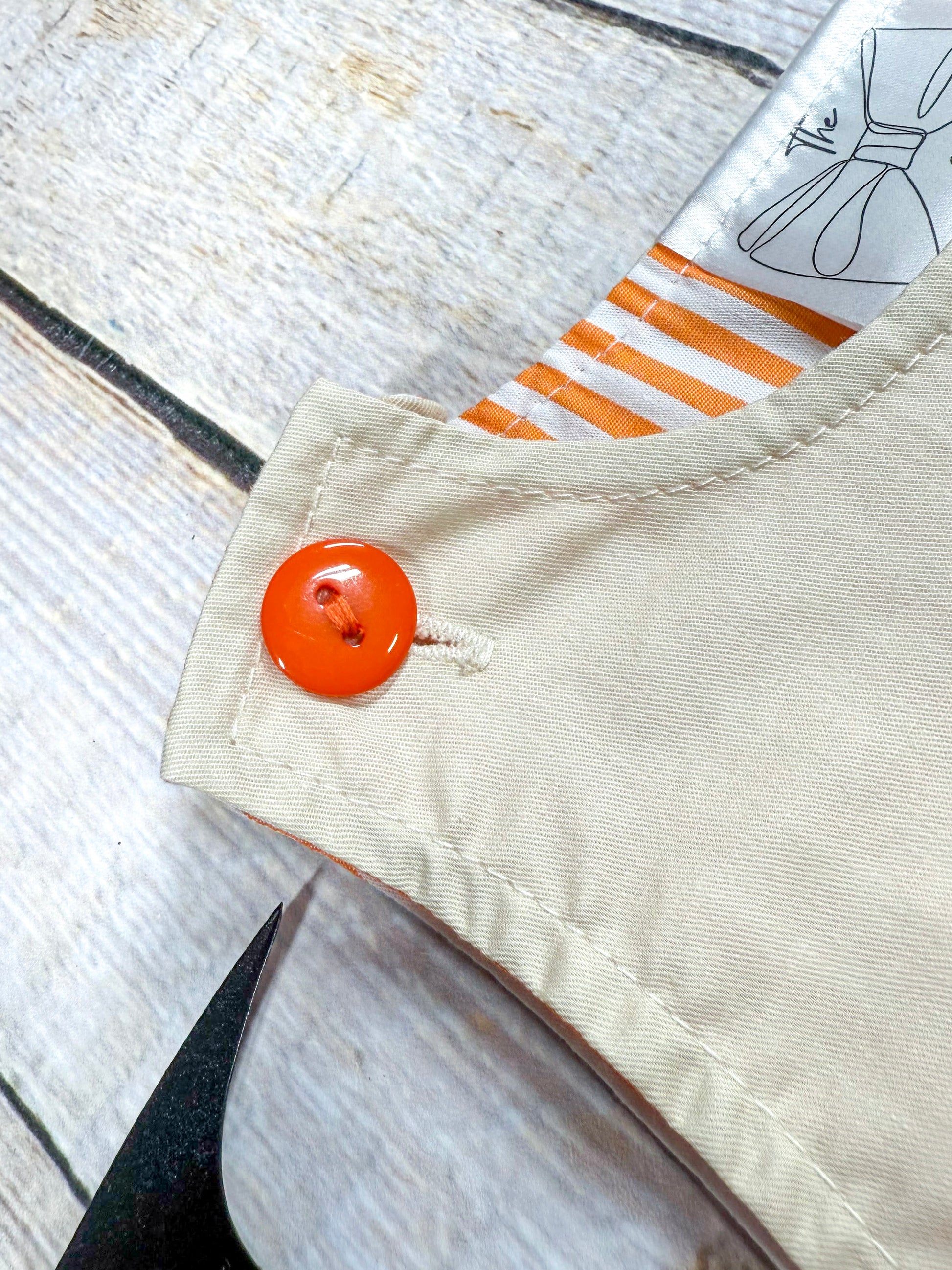 close up of the button at top of shoulder