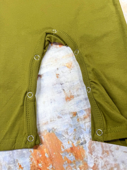 close up of the snaps on bottom of romper for easy changing
