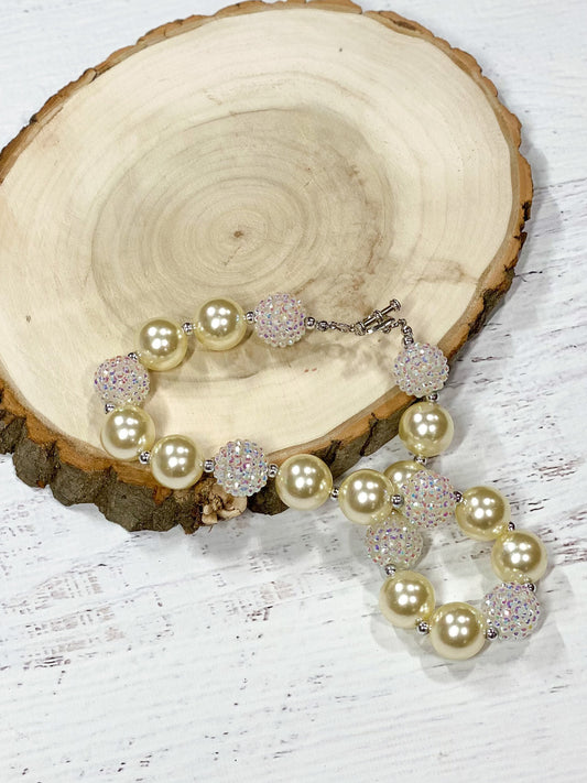 Ivory chunky bead necklace with a heart toggle closure.