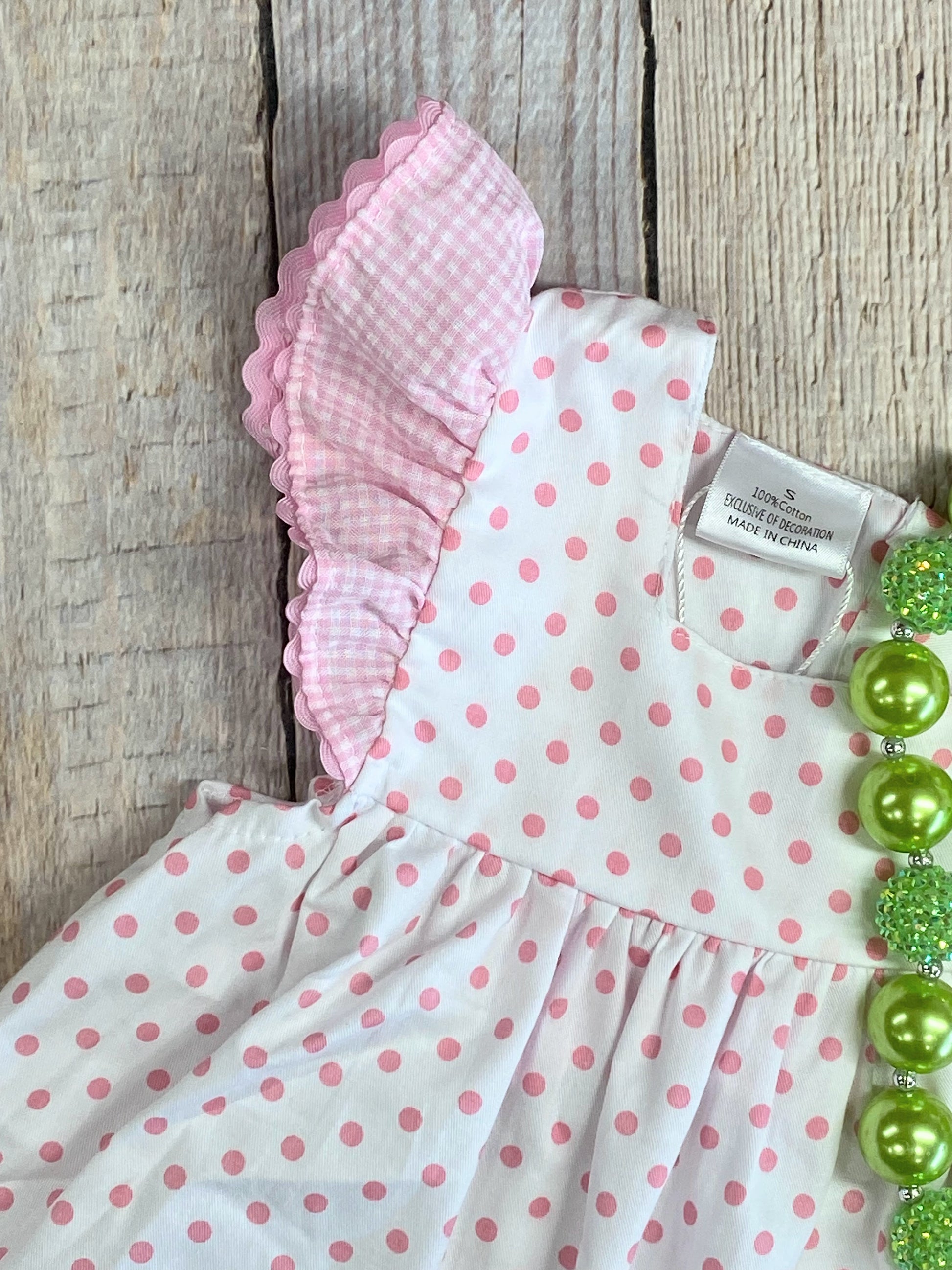 Close up detail photo of shoulder ruffle sleeve
