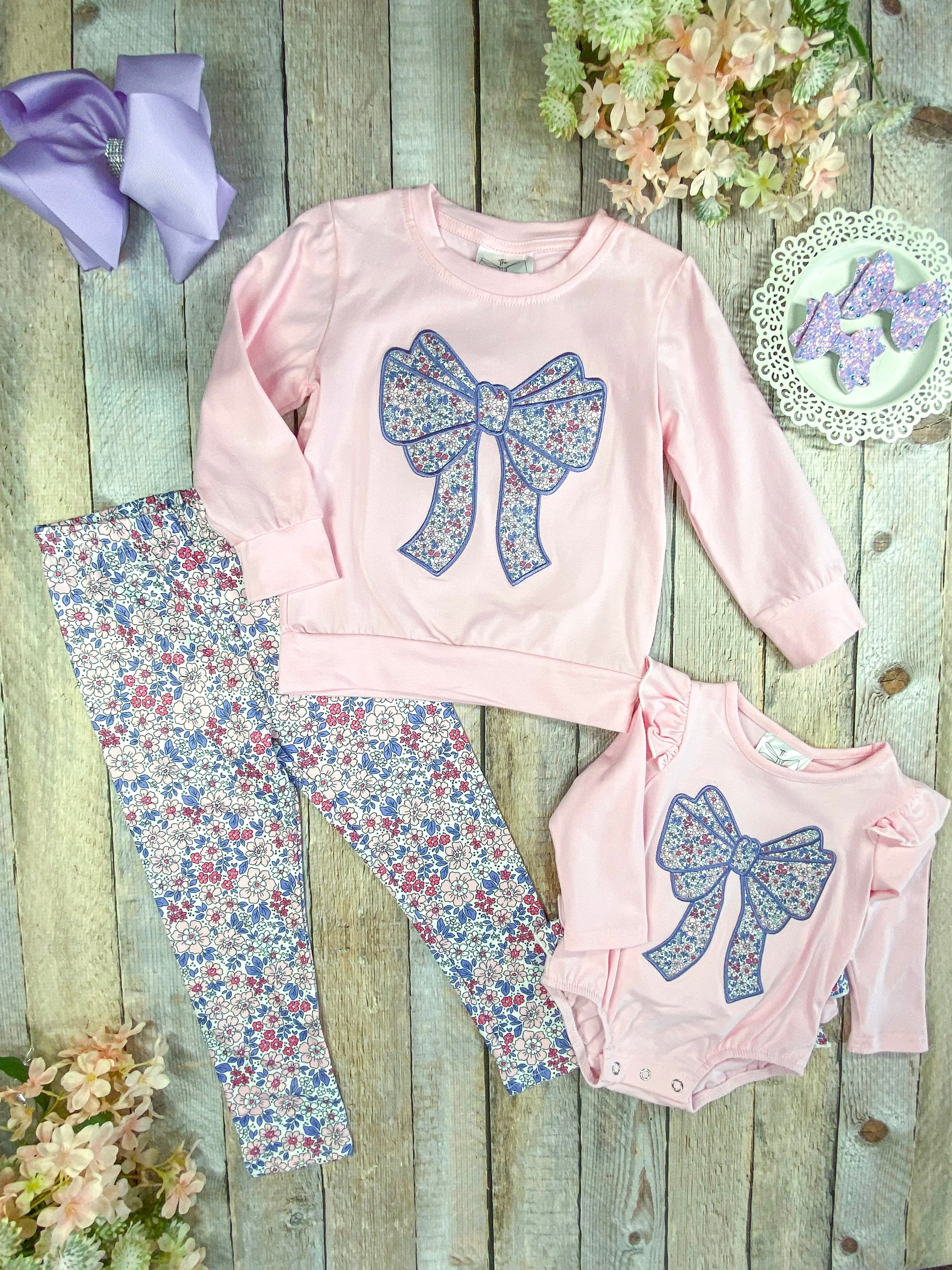infant romper next to the matching girl's outfit