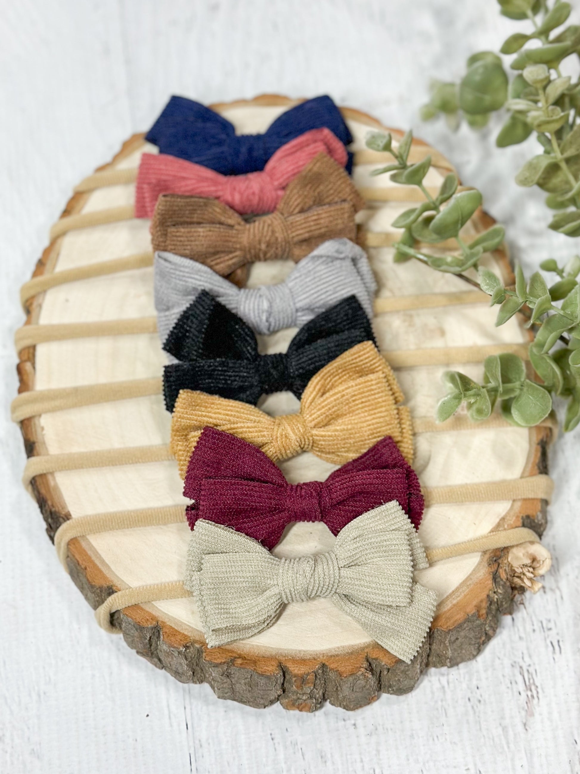 assortment of corduroy bow headbands in multiple colors