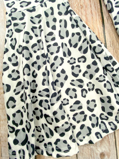 close up of the animal print on the bell bottom pants