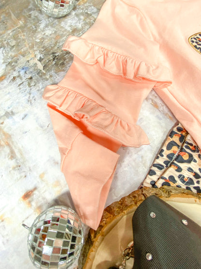 close up of ruffled sleeves