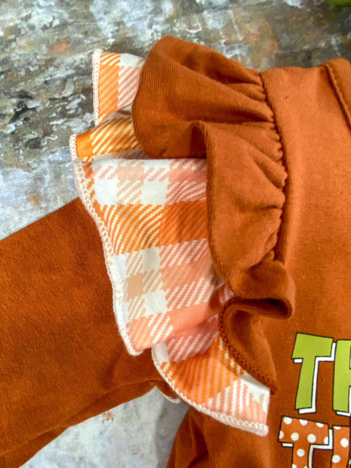 close up of the ruffles at the shoulder/top of sleeve