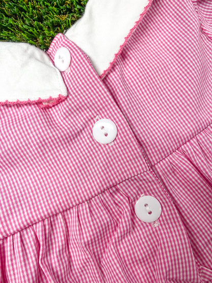 close up of the buttons on back of the onesie