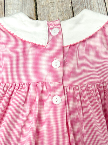 back of the dress showing 3 buttons starting from the collar and coming down