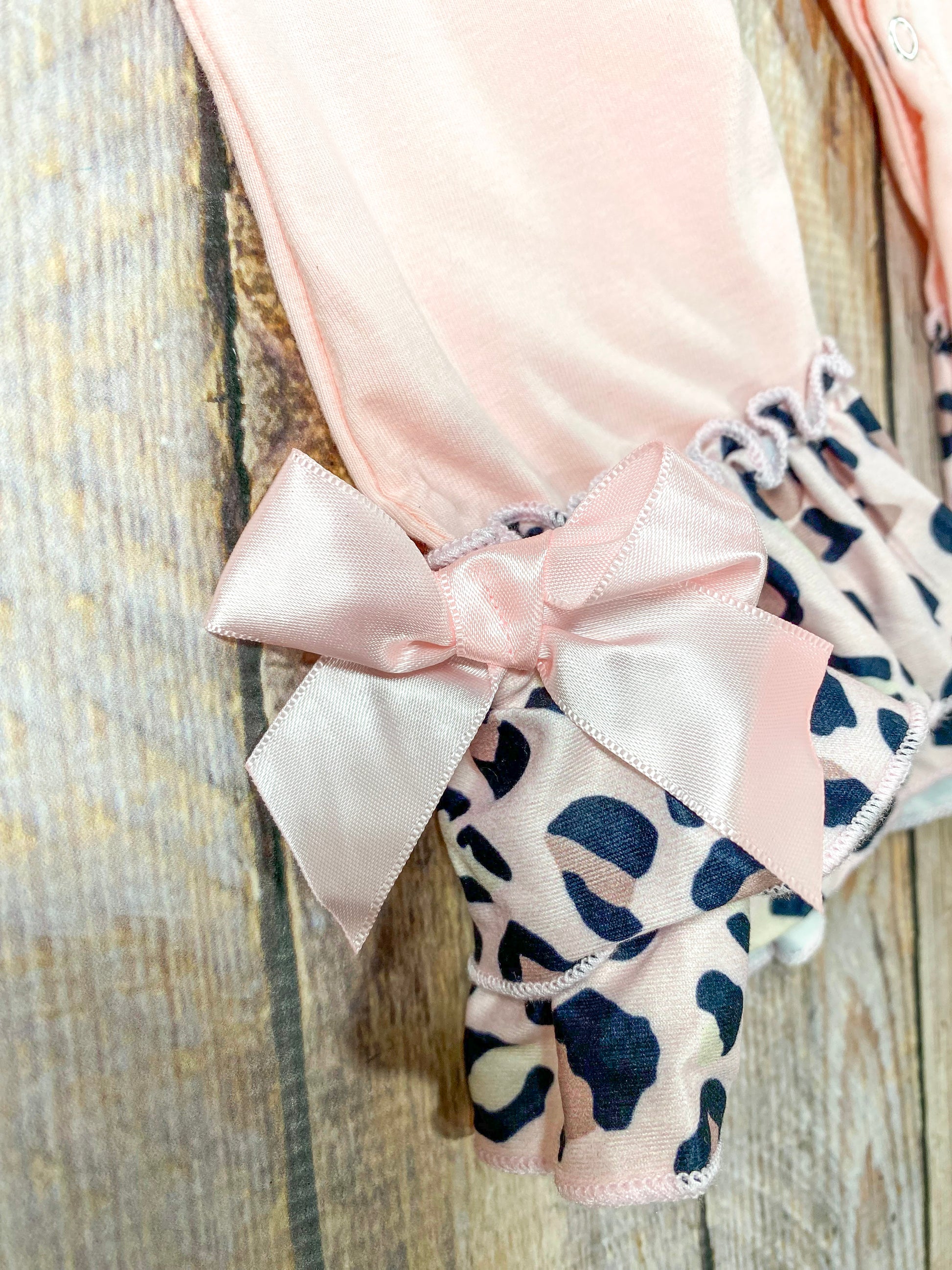 close up of the bow at the end of the pant leg