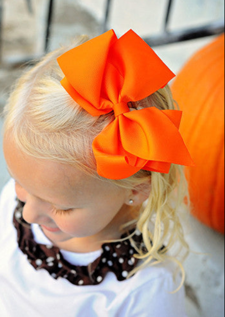 orange classic grosgrain hair bow on a model