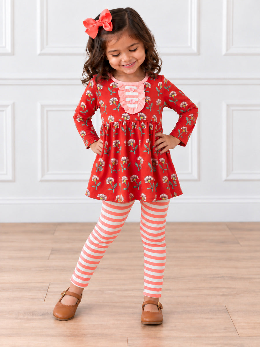 model wearing Floral tunic with pink striped leggings