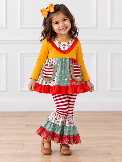 model wearing Patchwork tunic with mustard top and striped bell bottoms