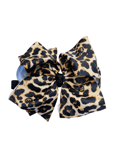 Leopard print hair bow on a white background