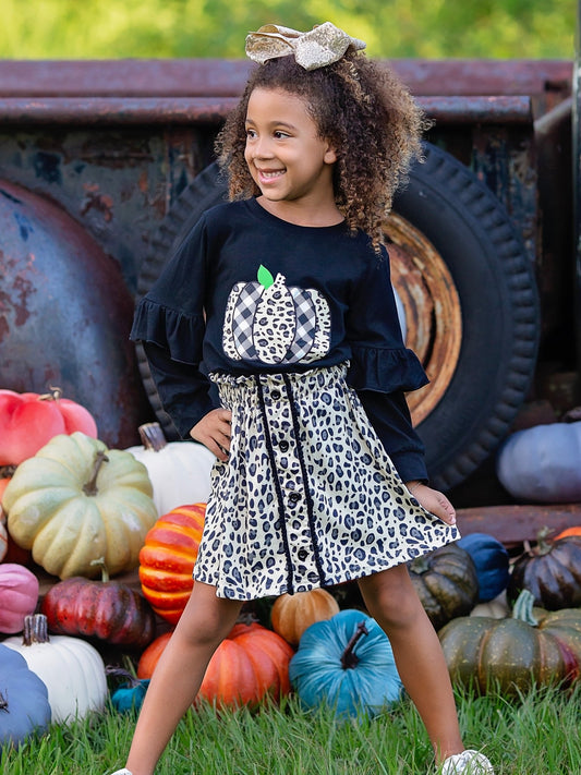 Girl wearing the animal print pumpkin skirt set