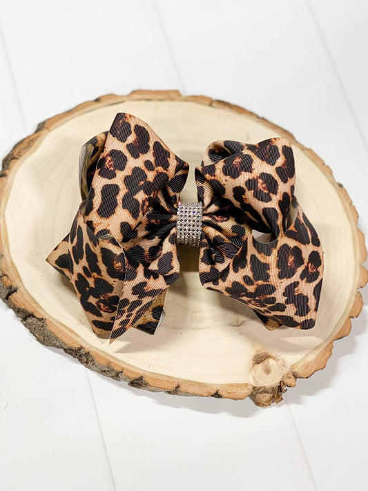 Leopard print 6 inch hair bow with rhinestone center on alligator clip