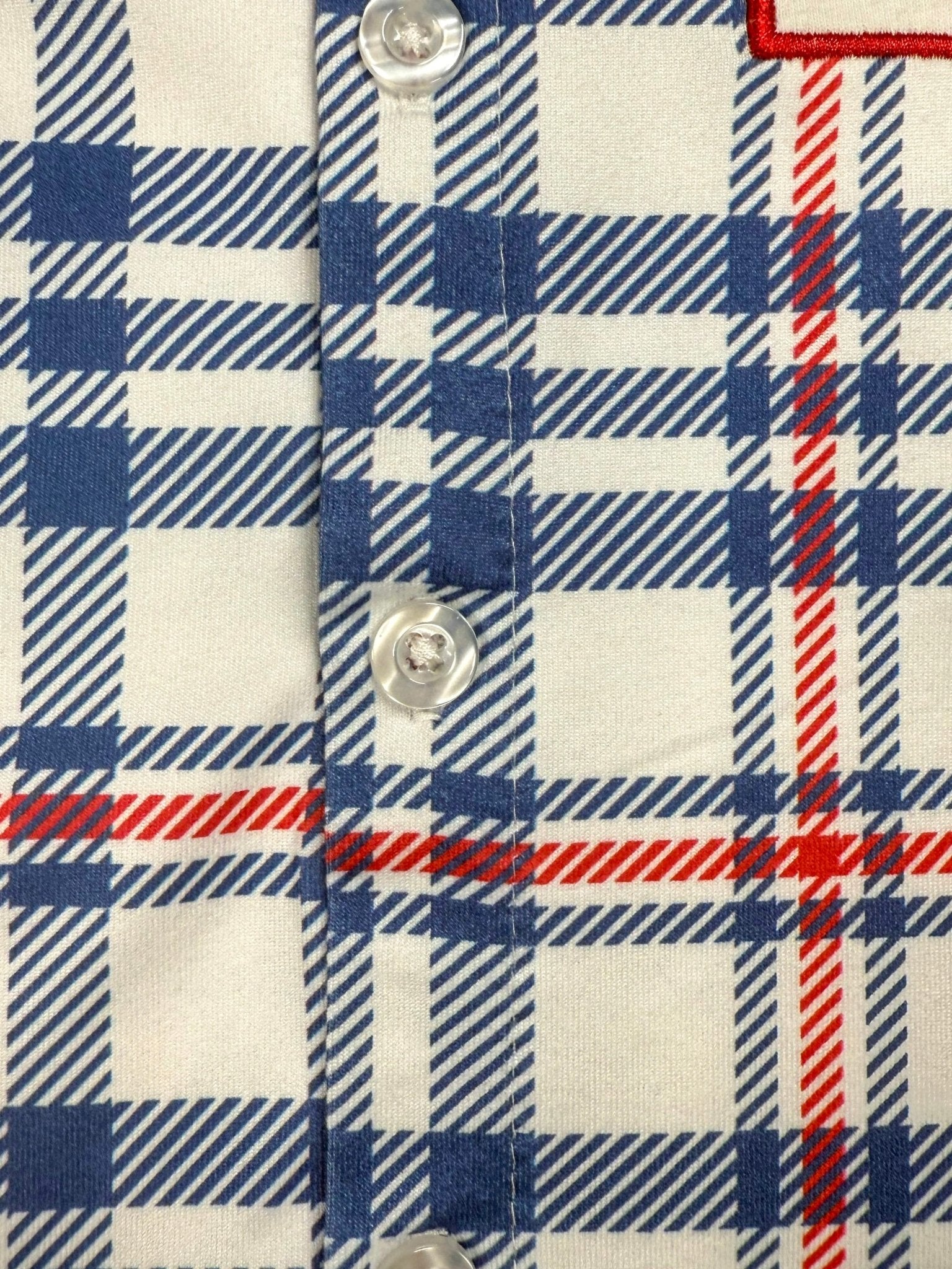 Close up photo of the buttons on front of the shirt