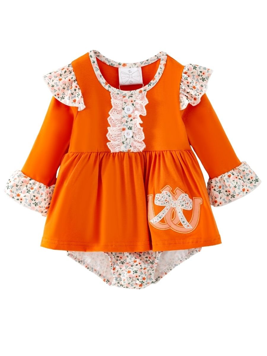 baby girl fall one-piece with horseshoe appliqué, lace ruffle bib, and floral cuffs